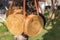 Rattan handbags hanging on the tree closeup. Bali island. Tropical background. No people.