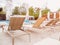 Rattan reclining chaise. Comfortable outdoor patio wicker chaise lounges. Swimming pool backyard resort furniture