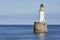 Rattray Head Lighthouse just off Rattray Point in Aberdeenshire  Scotland on a fine Summers afternoon.