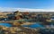 Raudholar lodge, Reykjavik, Iceland. Mossy Brown Lava. Red land under the blue sky.