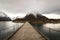 Rauma, Romsdalen in Norway - April, 19, 2017: A wooden bridge over the Rauma river leads to Andalsnes Camping, located