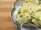 Rava upma in plate on wooden background