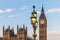 Raven on lampost at Houses of Parliament in early winter morning