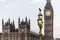 Raven on lampost at Houses of Parliament in early winter morning