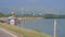 Ravens fly over special structure on water reservoir by dam