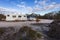 Raventhorpe, Australia - Mar 14,2021: A large white caravan and modern 4WD vehicle free camp in the outback at the old abandoned