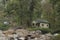 ravine boulders scattered inside woods with cottage