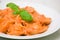 Ravioli in tomato-cream sauce