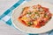 Ravioli with tomato sauce and parmesan