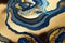 Ravishing blue and golden acrylic liquid ink swirl abstract background.