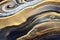 Ravishing blue and golden acrylic liquid ink swirl abstract background.