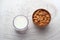 Raw almond glass of milk on wooden table.