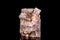 Raw aragonite mineral stone in front of black background