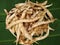 Raw Arrowroot or Maranta arundinacea on banana leaf background