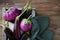 Raw aubergine in wood crate