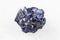 Raw Azurite mineral crystals on white marble