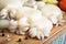 Raw babies cuttlefish on a cutting board closeup