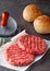 Raw Beef Hamburger Patties with Press and Rolls