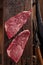 Raw beef marbled steak with vintage background