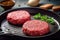 Raw beef meat hamburger patties in a frying pan