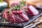 Raw beef meat. Raw beef tenderloin steak on a cutting board with rosemary pepper salt in other positions