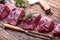 Raw beef meat. Raw beef tenderloin steak on a cutting board with rosemary pepper salt in other positions
