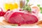 Raw beef meat tenderloin on white background with cooking ingredients closeup. Fresh beef meat on kitchen table