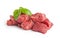 Raw beef pieces isolated on a white background.