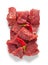 Raw beef pieces isolated on a white background.