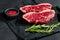 Raw beef ramp steak. Black background, top view.