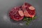 Raw beef shanks with herbs and Himalayan salt on gray background