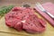 Raw beef side on a cutting board