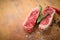 Raw beef sirloin Steak with seasoning on wooden background, preparing for BBQ