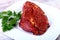 Raw beef steak with spices and Leaves of coriander on white plate. Ready for cooking.