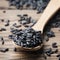 Raw black rice on the wooden table