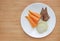 Raw of boiled meat and vegetables baby food pork liver, onion and sweet potato in white plate on wooden board