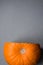 Raw Bright Orange Heirloom Pumpkin with Cut off Piece on Grey Stone Background. Thanksgiving Fall Autumn Halloween