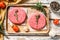 Raw Burger patties. Mince meat cutlet, ground beef and pork. White background. Top view