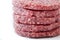 Raw burgers on a white background