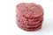 Raw burgers on a white background