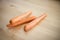 Raw carrots on wood table