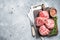 Raw Caul Fat Meatballs burger cutlets, fresh meat. Gray background. Top view. Copy space