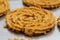 Raw chakali in plate. Indian Traditional Tea Time Snack Chakli, a deep fried snack, It is known as Chakali, Murukku, Muruku,