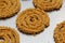 Raw chakali in plate. Indian Traditional Tea Time Snack Chakli, a deep fried snack, It is known as Chakali, Murukku, Muruku,