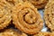 Raw chakali in plate. Indian Traditional Tea Time Snack Chakli, a deep fried snack, It is known as Chakali, Murukku, Muruku,