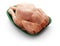 Raw chicken body in a green tray over white background