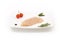 Raw chicken breast on white dish with herbs