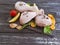 Raw chicken feet organic broiler on a wooden background, carrots, lemon, parsley, pepper