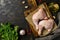 Raw chicken feet. Raw chicken legs on a cutting board, spices, olive oil, garlic, rucola leaves.