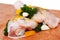 Raw chicken leg with herbs, garlic and pepper